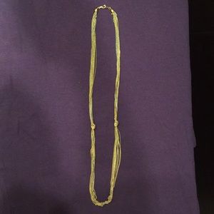 Vintage gold/silver toned knotted necklace. Pat. 537985.
